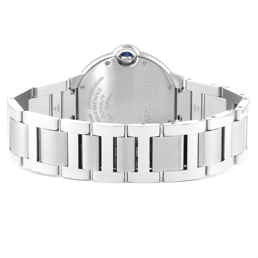 The image shows the backside of a Ballon Bleu model by Cartier, highlighting its stainless steel bracelet and case back.