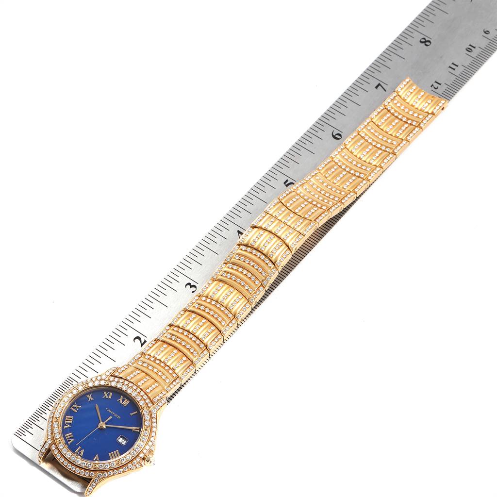 The image shows a top view of a Cartier Panthere 11651 Men's Yellow Gold Blue Dial 11651 Men's Yellow Gold Blue Dial watch with a blue dial and gold, diamond-studded band.