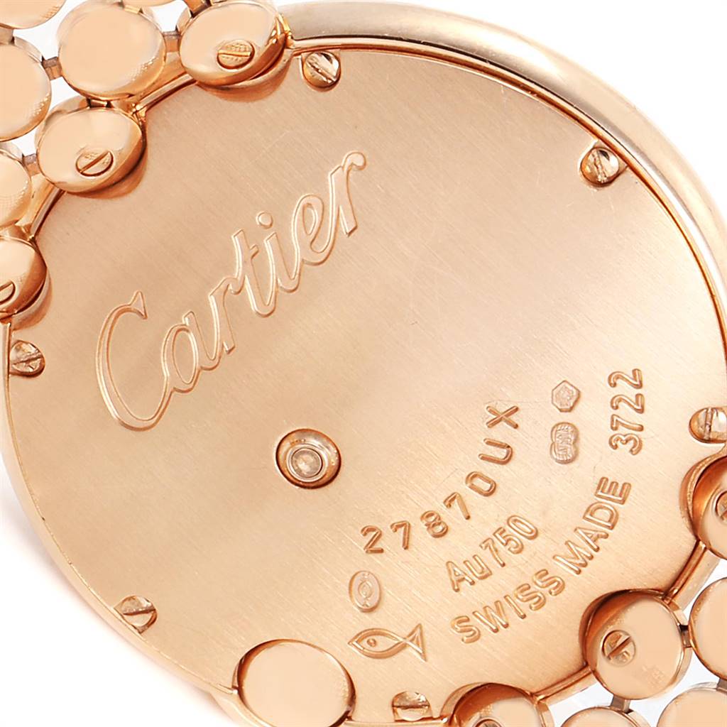 The image shows the back case and part of the bracelet of a Cartier Ballon Bleu watch.