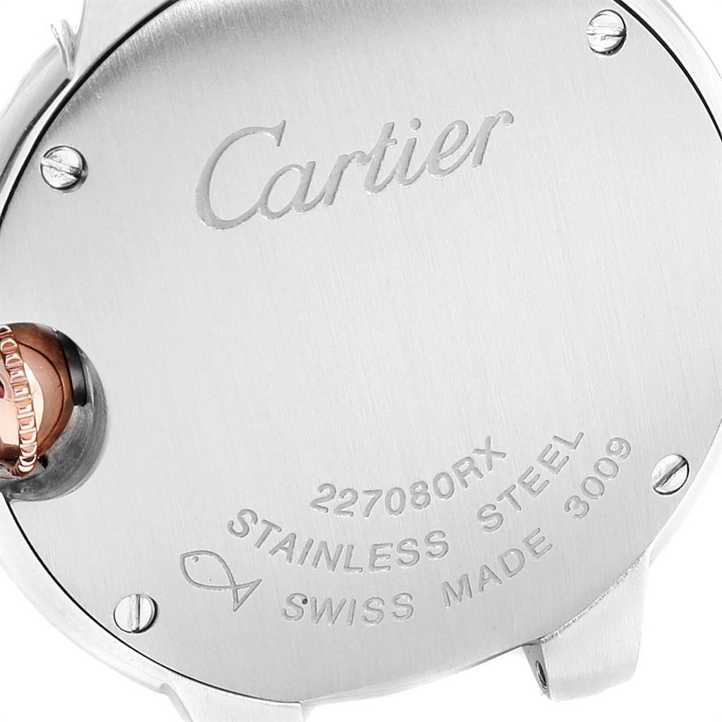 This image shows the back case of the Ballon Bleu watch by Cartier, highlighting the brand engraving and watch details.