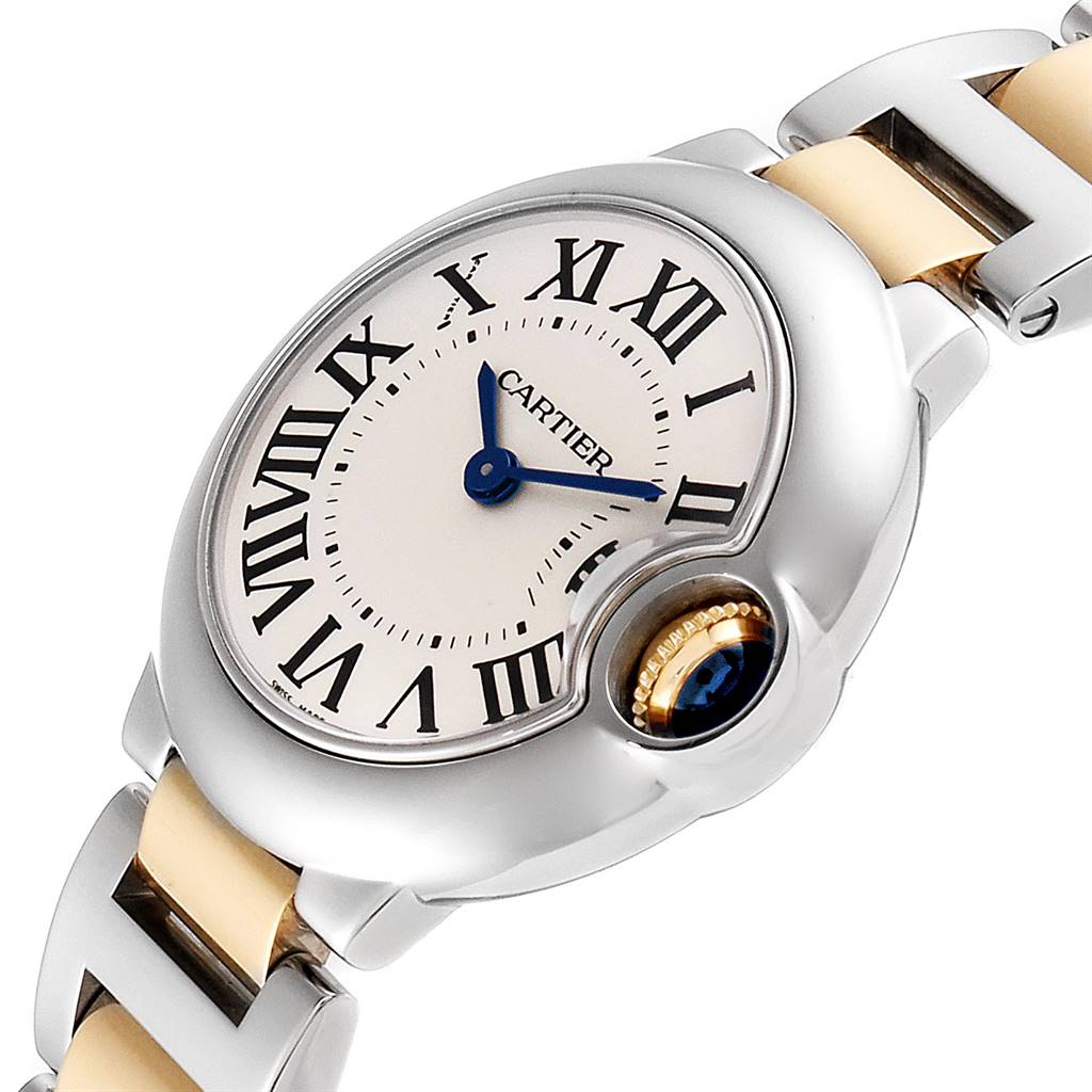 The image shows a close-up of the face and part of the band of a Cartier Ballon Bleu W69007Z3 Women
s Steel and Gold (two tone) Silver Dial W69007Z3 Women
s Steel and Gold (two tone) Silver Dial watch.