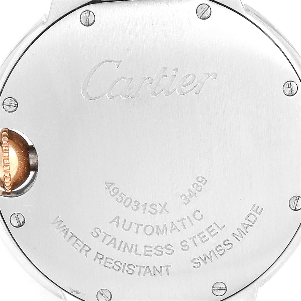 This image shows the back case of a Cartier Ballon Bleu W6920098 Women
s Steel and Gold (two tone) Mother of Pearl Dial W6920098 Women
s Steel and Gold (two tone) Mother of Pearl Dial watch, highlighting its engravings and screws.