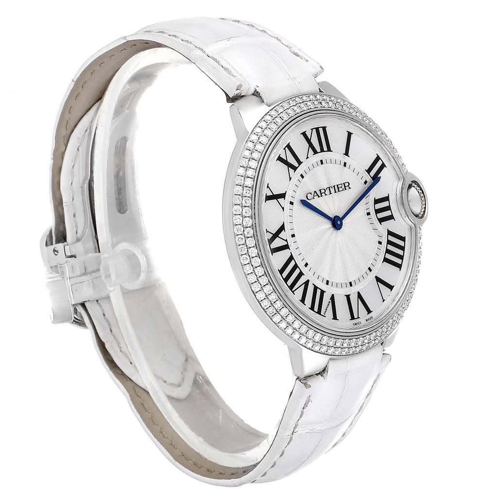 The image shows a side view of a Cartier Ballon Bleu WE902056 Women's White Gold Silver Dial WE902056 Women's White Gold Silver Dial watch, highlighting its white leather strap and diamond bezel.