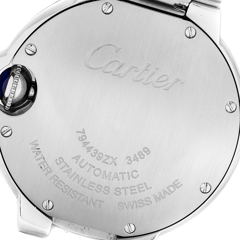 The image shows the case back of a Cartier Ballon Bleu WE902074 Women
s Stainless Steel Silver Dial WE902074 Women
s Stainless Steel Silver Dial watch, engraved with details and brand name.