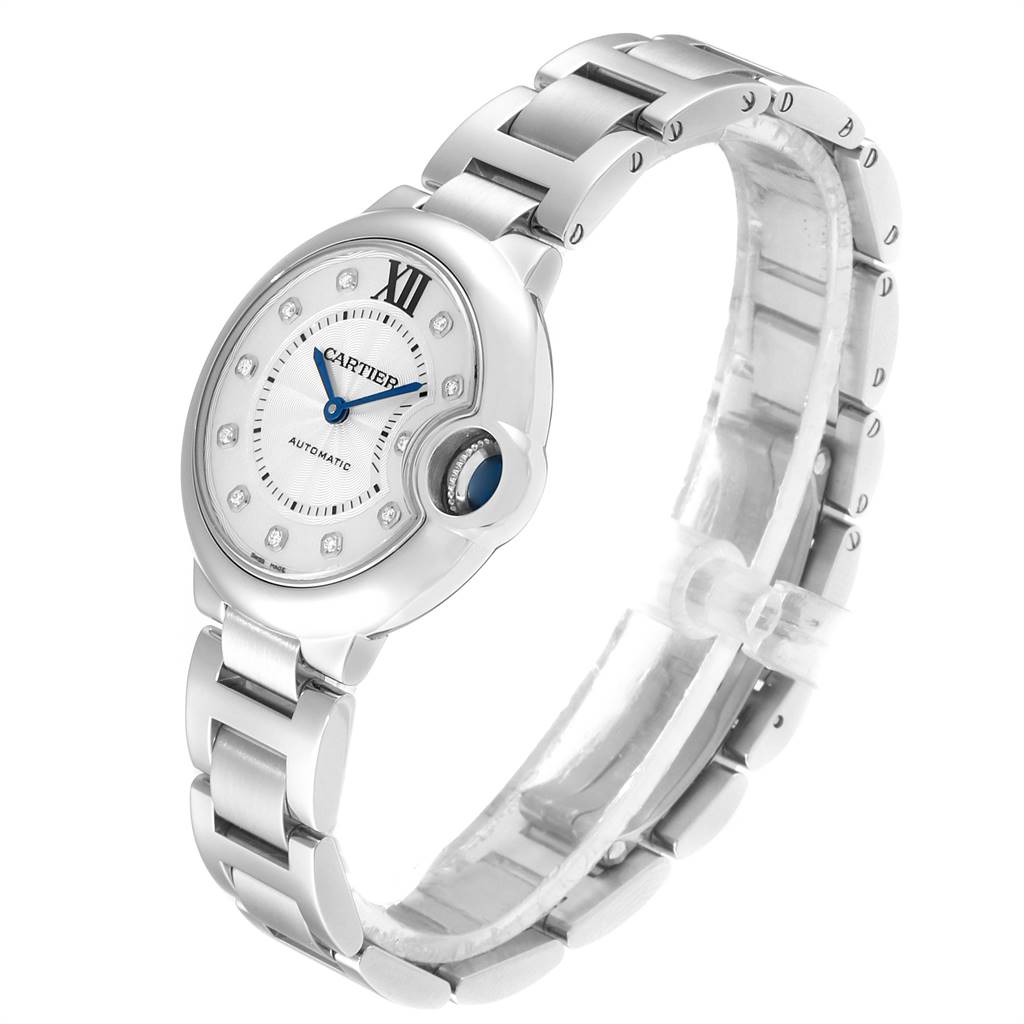 The image shows a Cartier Ballon Bleu WE902074 Women
s Stainless Steel Silver Dial WE902074 Women
s Stainless Steel Silver Dial watch from an angled side view, highlighting the face, bezel, and part of the bracelet.