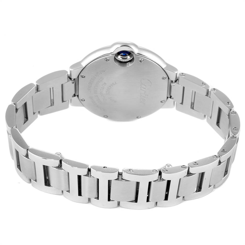 The image shows the back case and bracelet of a Ballon Bleu de Cartier watch, highlighting the stainless steel construction and clasp details.