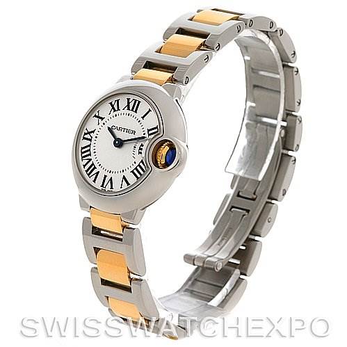 The image shows a Ballon Bleu de Cartier watch at an angled side view, highlighting its round case and two-tone bracelet.