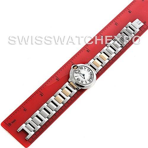 The image shows a Cartier Ballon Bleu W69007Z3 Women
s Stainless Steel Silver Dial W69007Z3 Women
s Stainless Steel Silver Dial watch placed horizontally next to a red ruler, displaying the full face and metal bracelet.