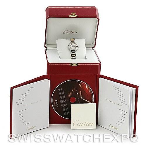 The image shows a Ballon Bleu de Cartier watch in its open box with accompanying booklets and a CD.