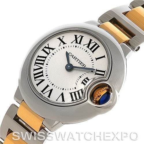 This image shows a Cartier watch with a round face and Roman numerals, displayed from a slightly tilted top-down angle.