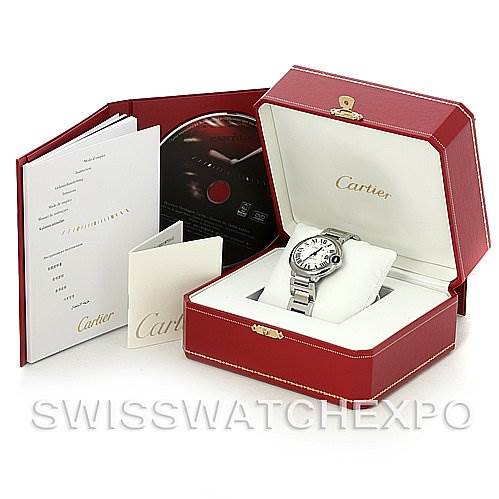 The image shows a Cartier Ballon Bleu W6920046 Stainless Steel Silver Dial W6920046 Stainless Steel Silver Dial watch in a red box with accompanying documents and a CD.