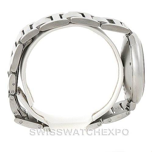 The image shows a side view of the Ballon Bleu by Cartier, focusing on its stainless steel bracelet and case.