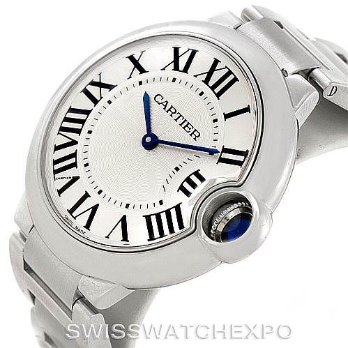 This image shows a front-side angle of the Cartier Ballon Bleu W69011Z4 Women
s Stainless Steel Silver Dial W69011Z4 Women
s Stainless Steel Silver Dial watch, highlighting its Roman numeral dial, blue hands, and crown with a sapphire cabochon.