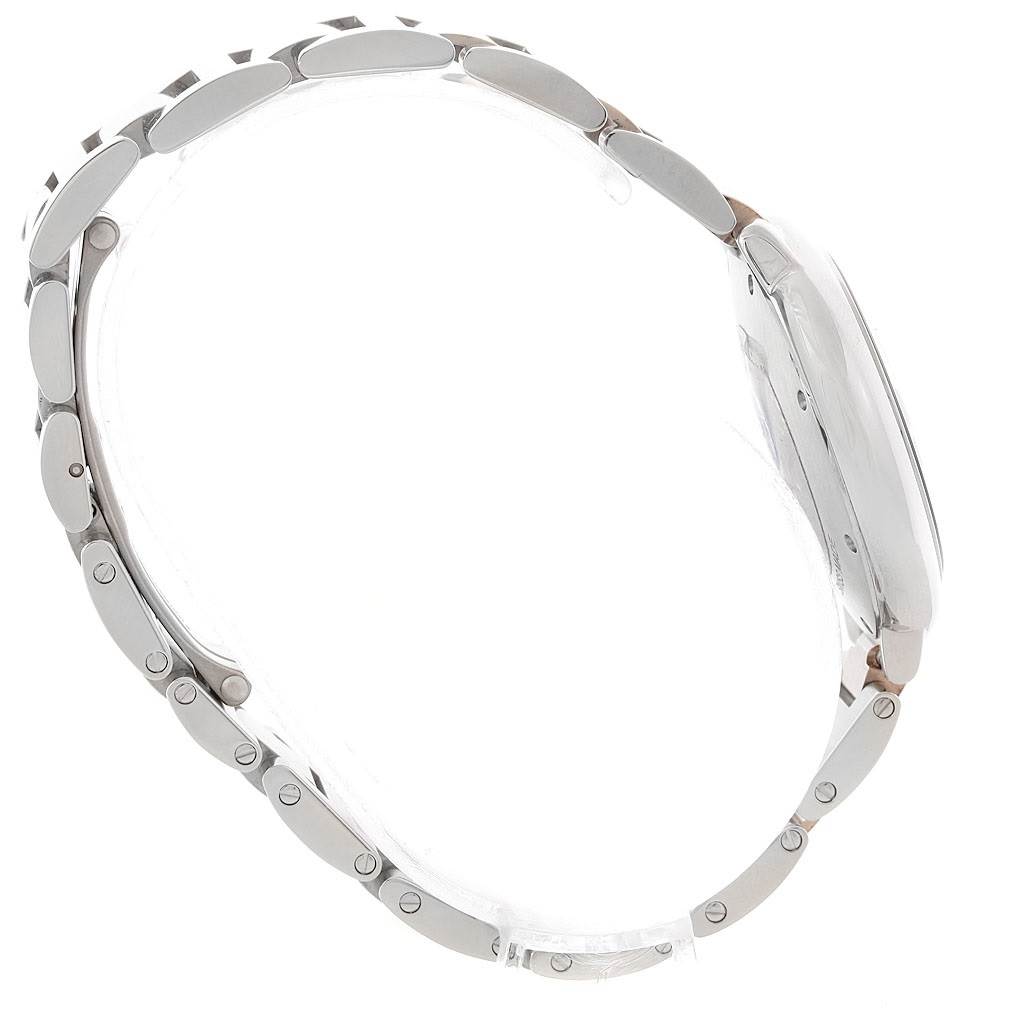 The image shows a side angle of a Ballon Bleu de Cartier watch, highlighting its bracelet links and case profile.