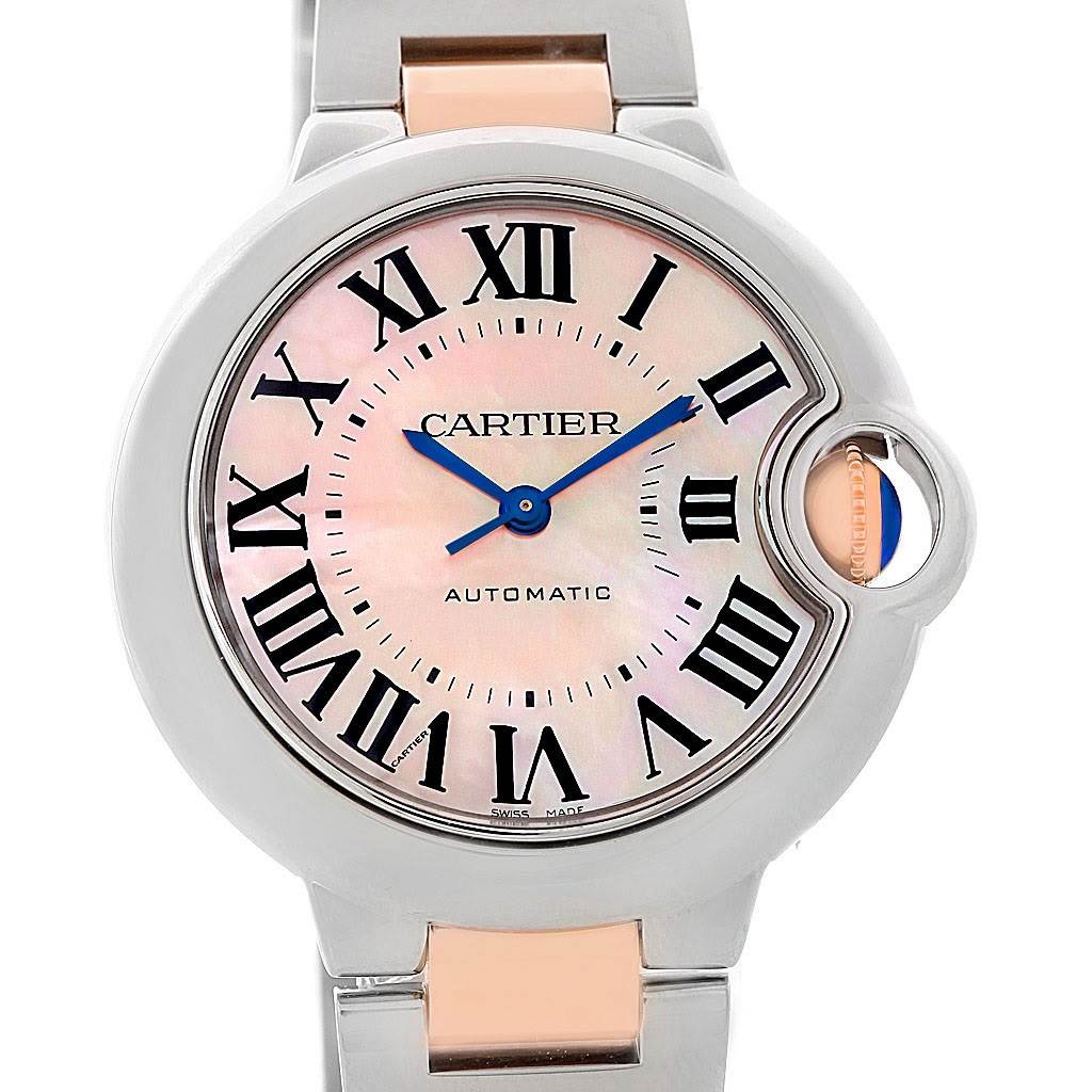 The image shows a front view of the Cartier Ballon Bleu W6920070 Women's Steel and Gold (two tone) Mother of Pearl Dial W6920070 Women's Steel and Gold (two tone) Mother of Pearl Dial watch, highlighting its dial and part of the bracelet.