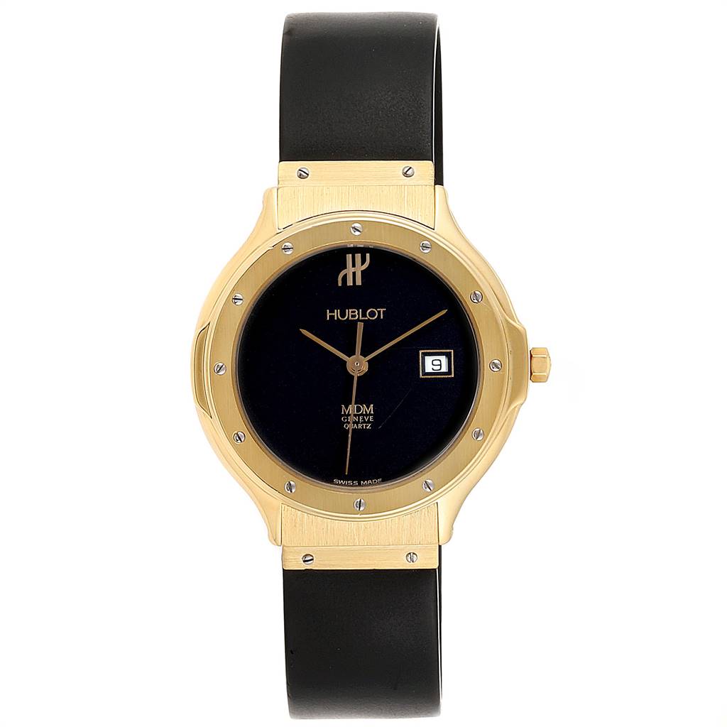 The image shows a front view of the Hublot 140.10.3 Women's Yellow Gold Black Dial 140.10.3 Women's Yellow Gold Black Dial MDM Geneve Classic 18K Yellow Gold Ladies Watch 140.10.3 model, displaying its dial and strap.