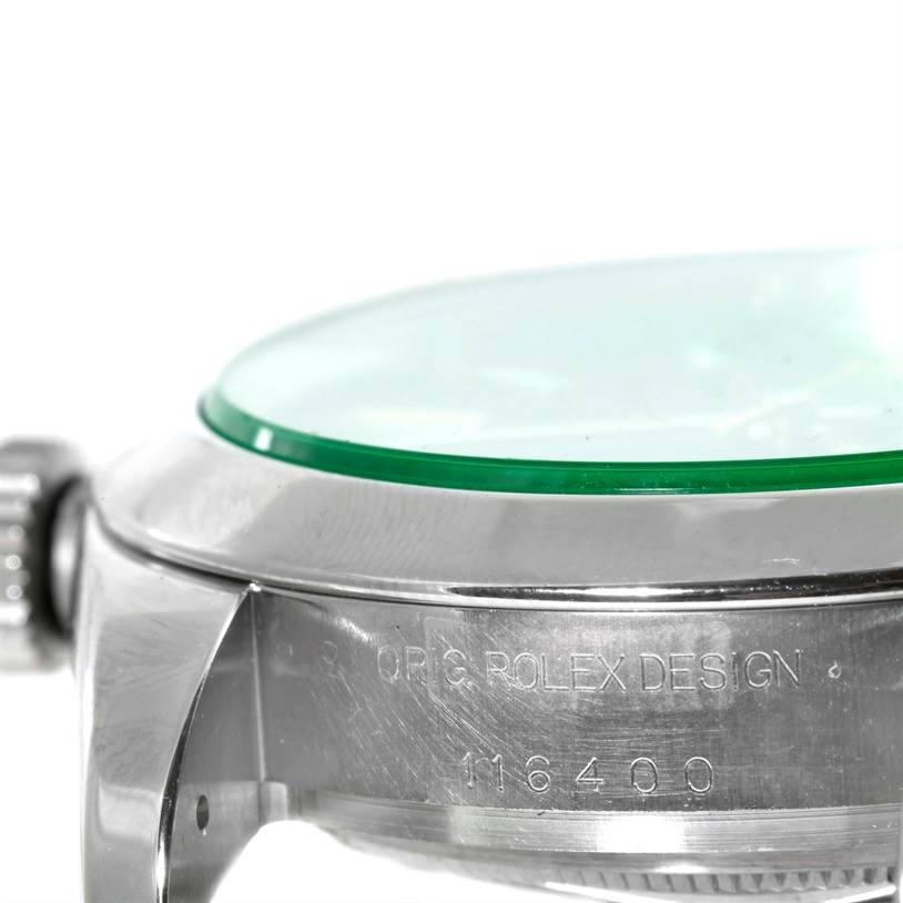 This close-up side view of the Rolex Milgauss 116400V Men's Stainless Steel Black Dial 116400V Men's Stainless Steel Black Dial watch shows the crown, case, and green sapphire crystal.