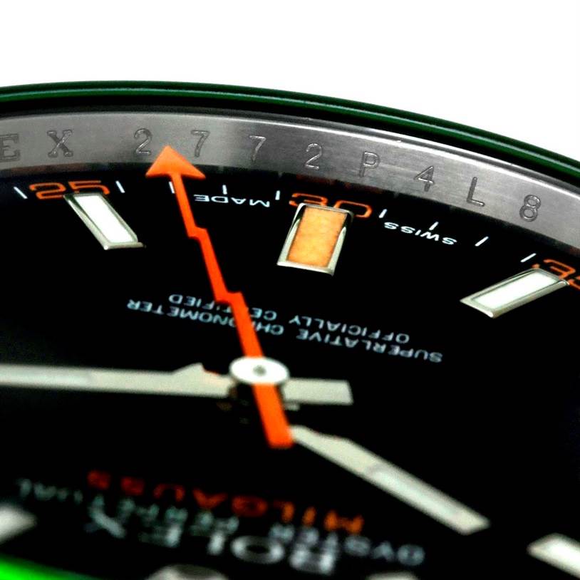 This close-up image shows the dial and bezel of the Rolex Milgauss 116400V Men's Stainless Steel Black Dial 116400V Men's Stainless Steel Black Dial watch, focusing on the orange lightning bolt-shaped second hand and markers.