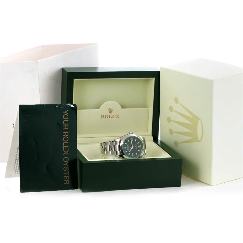The image shows a Rolex Milgauss 116400V Men's Stainless Steel Black Dial 116400V Men's Stainless Steel Black Dial watch at an angle in its open box with associated packaging and booklets.
