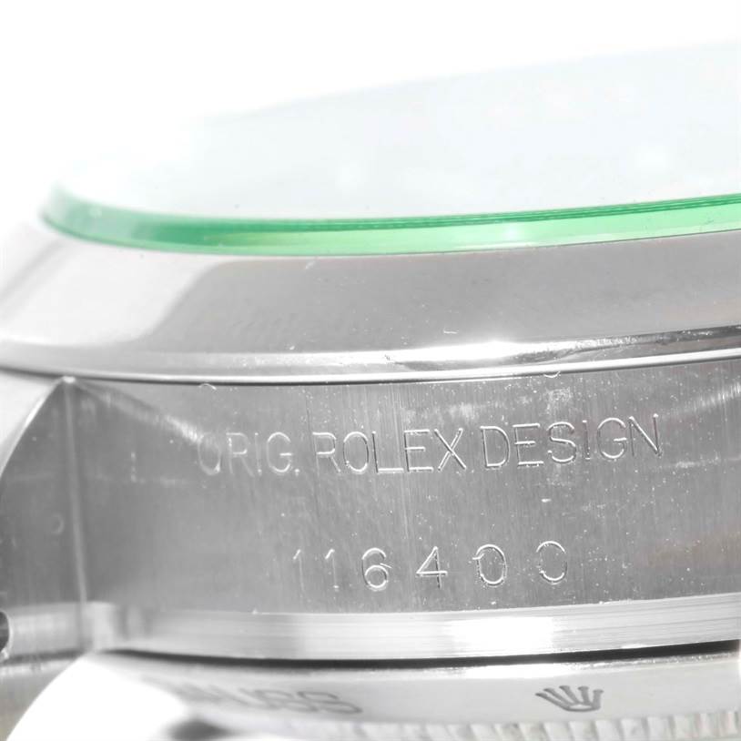 The image shows a close-up of the side of the Rolex Milgauss 116400V Men's Stainless Steel Black Dial 116400V Men's Stainless Steel Black Dial watch, highlighting the case with "ORIG. ROLEX DESIGN" and model number 116400 engraved.