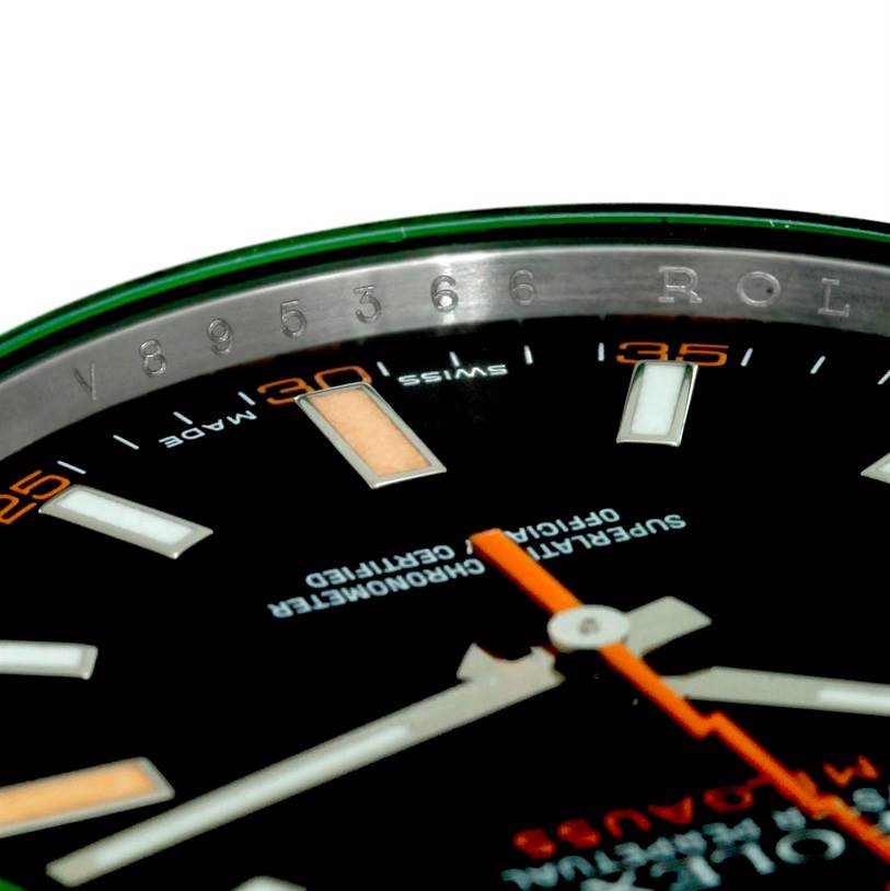 The image shows a close-up of the face and bezel of the Rolex Milgauss 116400V Men's Stainless Steel Black Dial 116400V Men's Stainless Steel Black Dial watch, highlighting the dial and some of the minute markers.