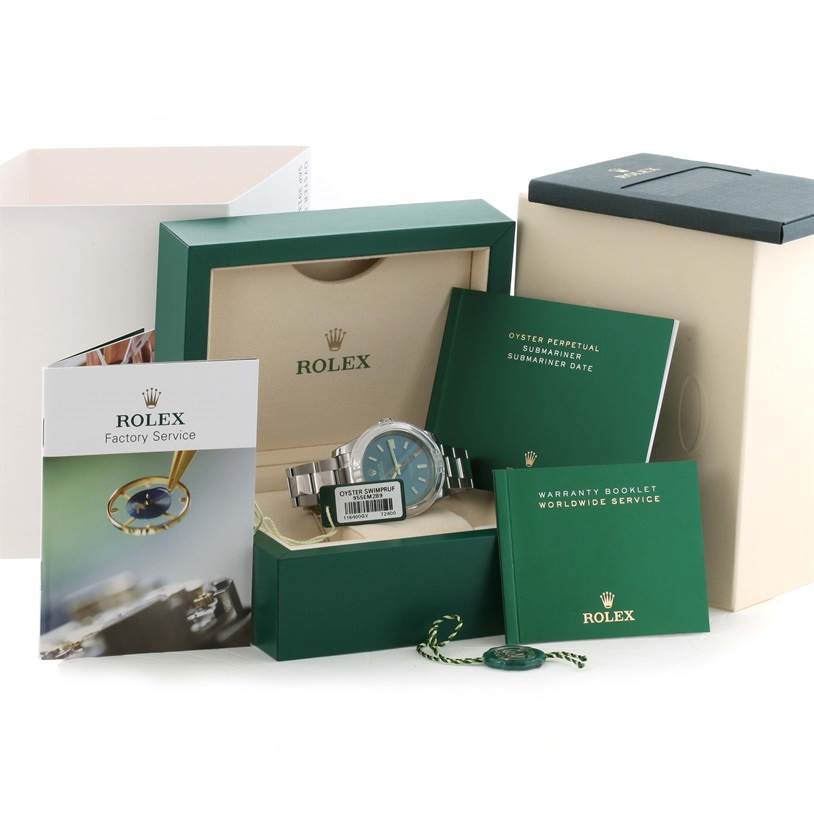 The image shows a Rolex Milgauss 116400GV Men's Stainless Steel Blue Dial 116400GV Men's Stainless Steel Blue Dial watch from the front inside its packaging, accompanied by booklets and a tag.