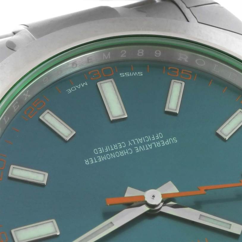 The image shows a close-up of the Rolex Milgauss 116400GV Men's Stainless Steel Blue Dial 116400GV Men's Stainless Steel Blue Dial watch's dial, highlighting the green sapphire crystal and luminescent markers.