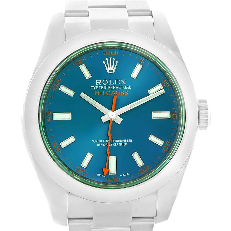 The image shows a front view of the Rolex Milgauss watch, displaying its blue dial, green sapphire crystal, and stainless steel bracelet.