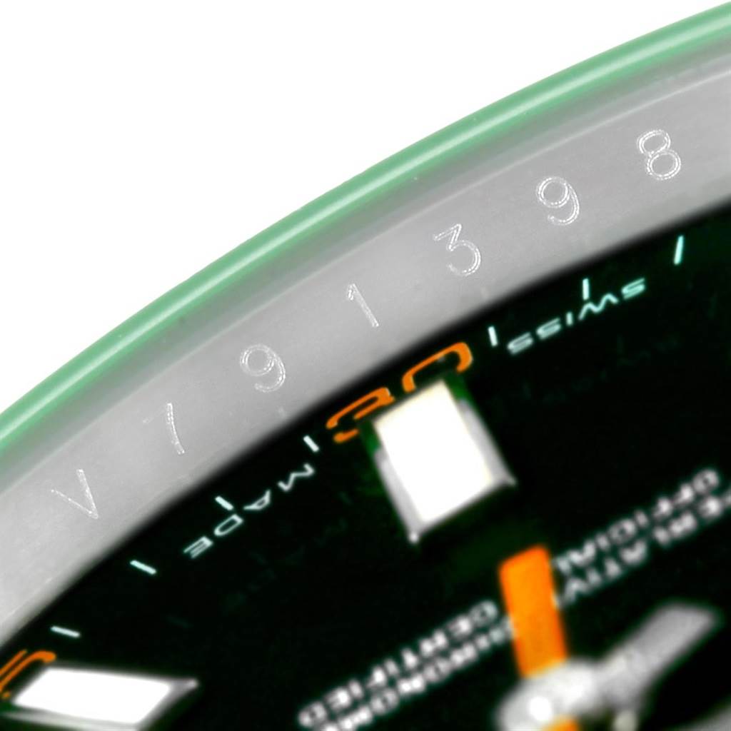 Close-up of the Rolex Milgauss 116400V Men's Stainless Steel Black Dial 116400V Men's Stainless Steel Black Dial watch showing the edge of the dial, part of the minute hand, and serial numbers on the flange.