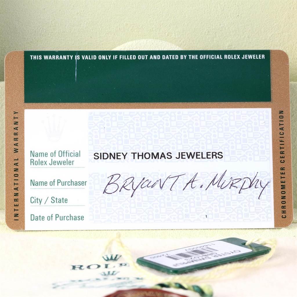 This image shows the international warranty card and tag for a Rolex Milgauss 116400V Men's Stainless Steel Black Dial 116400V Men's Stainless Steel Black Dial watch.