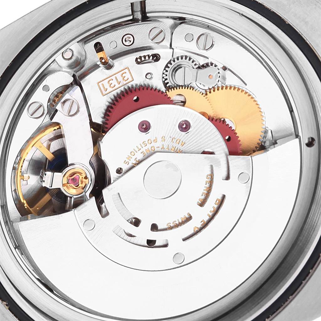 This close-up image shows the intricate inner mechanism of a Rolex Milgauss 116400V Men's Stainless Steel Black Dial 116400V Men's Stainless Steel Black Dial watch.