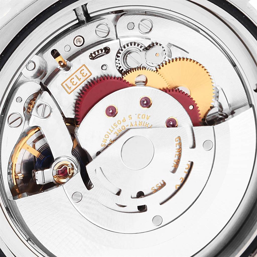 The image shows the intricate internal mechanism, including gears and components, of a Rolex Milgauss 116400V Men's Stainless Steel Black Dial 116400V Men's Stainless Steel Black Dial watch from a close-up angle.