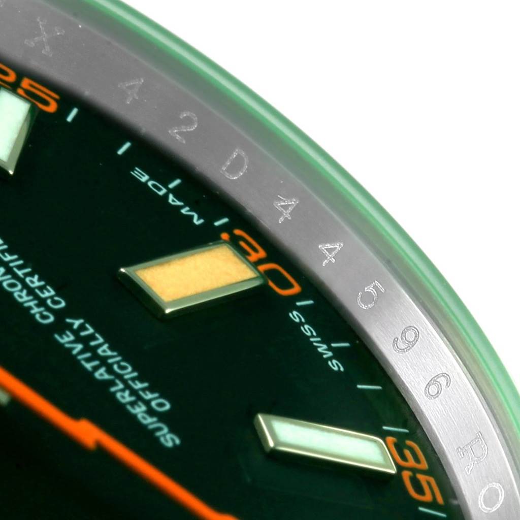 This image shows a close-up of the Rolex Milgauss 116400V Men's Stainless Steel Black Dial 116400V Men's Stainless Steel Black Dial watch face, focusing on the hour markers, minutes scale, and part of the bezel.