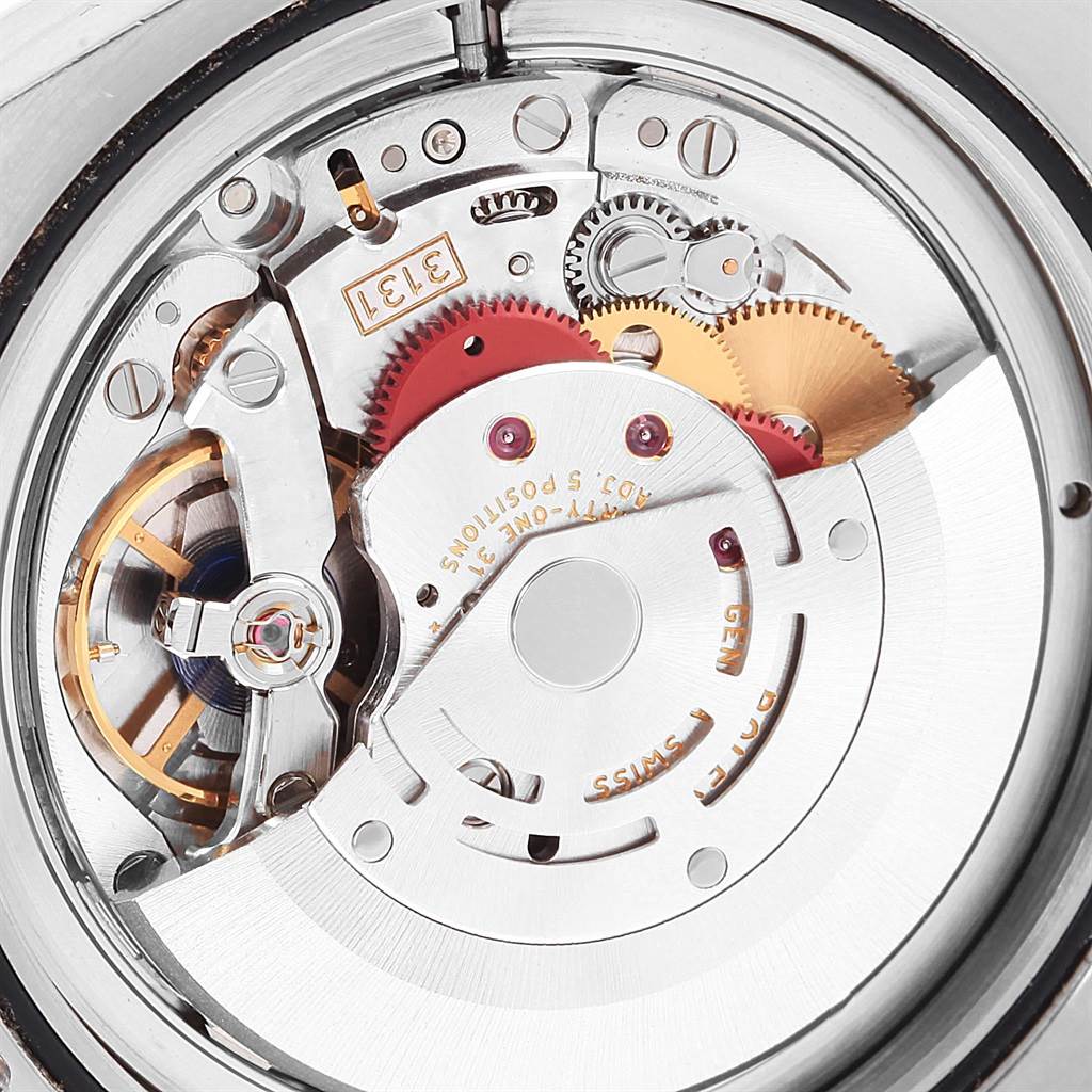 This image shows a close-up of the internal movement mechanism of a Rolex Milgauss 116400V Men's Stainless Steel Black Dial 116400V Men's Stainless Steel Black Dial watch, highlighting gears and components.