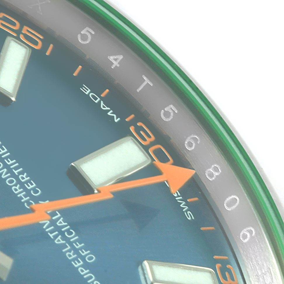 The image shows a close-up of the dial and orange lightning bolt second hand of a Rolex Milgauss 116400GV Men's Stainless Steel Blue Dial 116400GV Men's Stainless Steel Blue Dial watch.