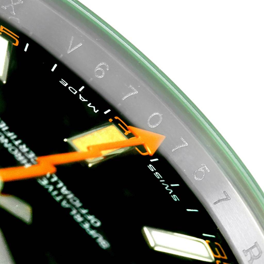 Close-up of the dial of the Rolex Milgauss 116400V Men's Stainless Steel Black Dial 116400V Men's Stainless Steel Black Dial model showing an orange lightning bolt second hand and the numbered chapter ring.