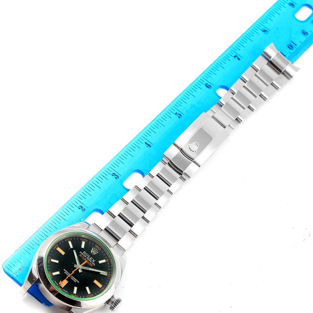 This image shows the front of a Rolex Milgauss 116400V Men's Stainless Steel Black Dial 116400V Men's Stainless Steel Black Dial watch, including the face and full bracelet, aligned with a ruler.