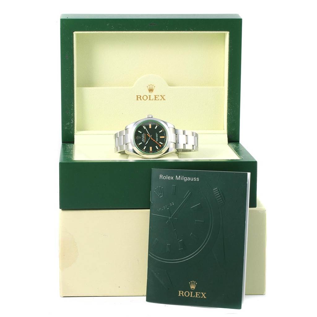 The Rolex Milgauss 116400V Men's Stainless Steel Black Dial 116400V Men's Stainless Steel Black Dial watch is displayed front-facing in its open branded box with the model's booklet in front.