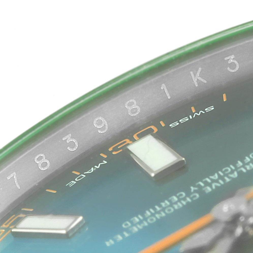 This close-up shows the dial and edge of the green-tinted crystal of the Rolex Milgauss 116400GV Men's Stainless Steel Blue Dial 116400GV Men's Stainless Steel Blue Dial watch.