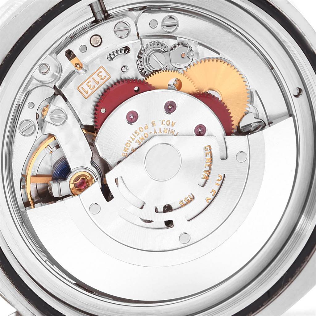 The image shows a close-up view of the movement of a Rolex Milgauss 116400GV Men's Stainless Steel Blue Dial 116400GV Men's Stainless Steel Blue Dial watch, highlighting its intricate gears and internal components.