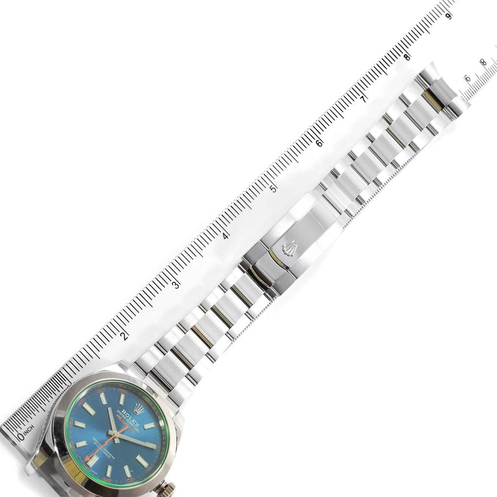 This image shows a Rolex Milgauss 116400GV Men's Stainless Steel Blue Dial 116400GV Men's Stainless Steel Blue Dial watch laid flat with a ruler for reference, highlighting the dial, case, and bracelet.