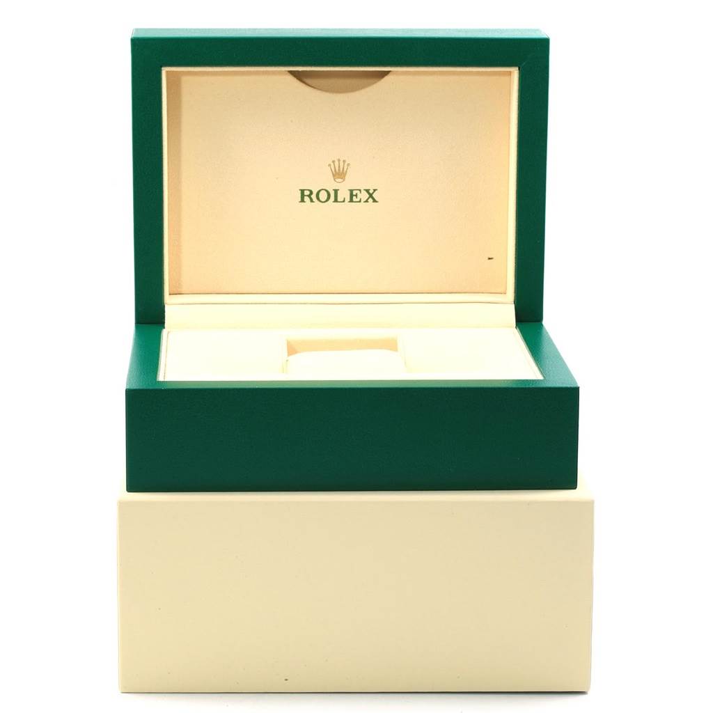 The image shows an open Rolex watch box for the Milgauss model, displaying the interior space for the watch.