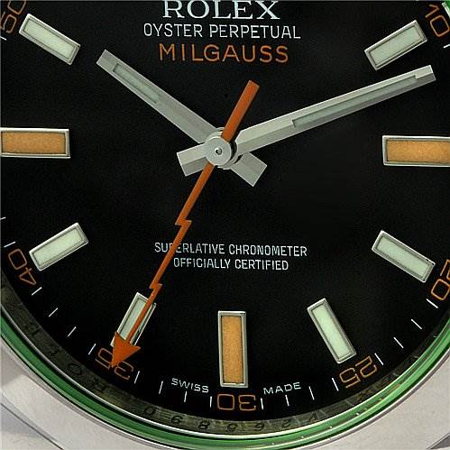 The image shows a close-up of the dial and hands, highlighting the second hand and hour markers of the Rolex Oyster Perpetual Milgauss.