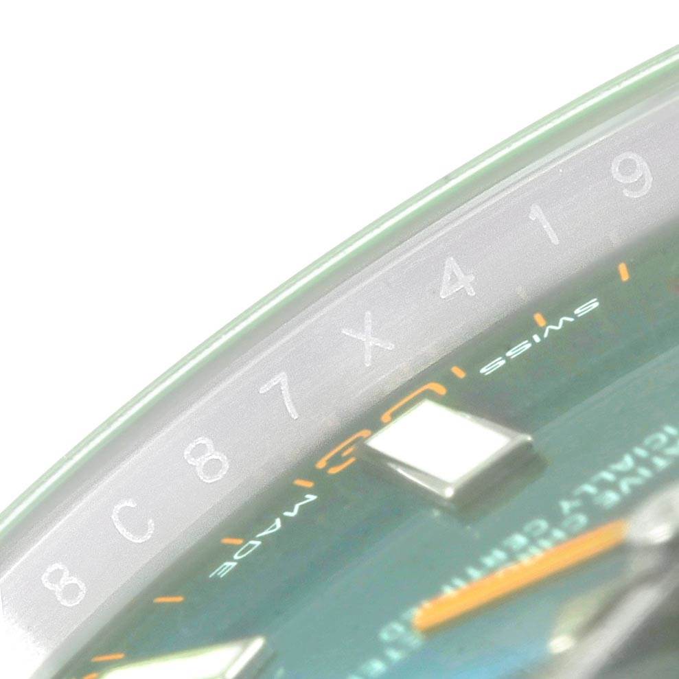 This image shows a close-up view of the numeral engraving and part of the dial of a Rolex Milgauss 116400GV Men's Stainless Steel Blue Dial 116400GV Men's Stainless Steel Blue Dial watch.