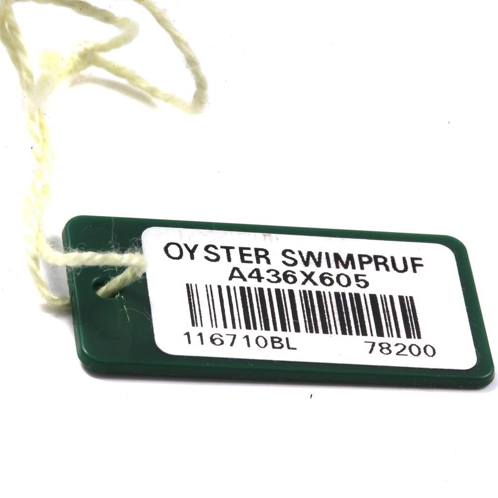 This image shows a green tag with a barcode, labeled "Oyster Swimpruf," which is associated with the Rolex Milgauss 116400V Men's Stainless Steel Black Dial 116400V Men's Stainless Steel Black Dial model watch.