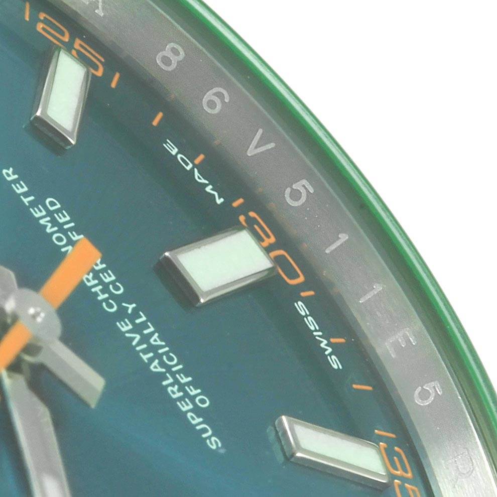 This close-up angle of the Rolex Milgauss 116400V Men's Stainless Steel Blue Dial 116400V Men's Stainless Steel Blue Dial watch shows the dial with hour indices and partial text.