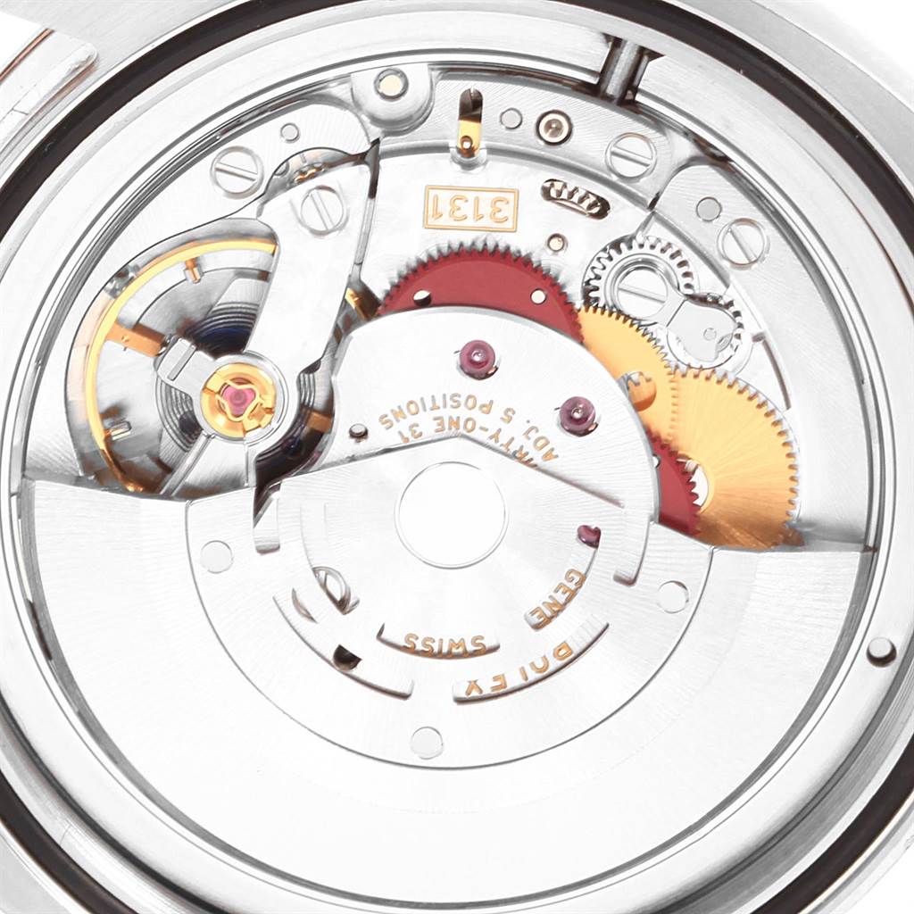 The image shows a close-up of the movement mechanism of a Rolex Milgauss 116400V Men's Stainless Steel Blue Dial 116400V Men's Stainless Steel Blue Dial watch, revealing gears and intricate components.