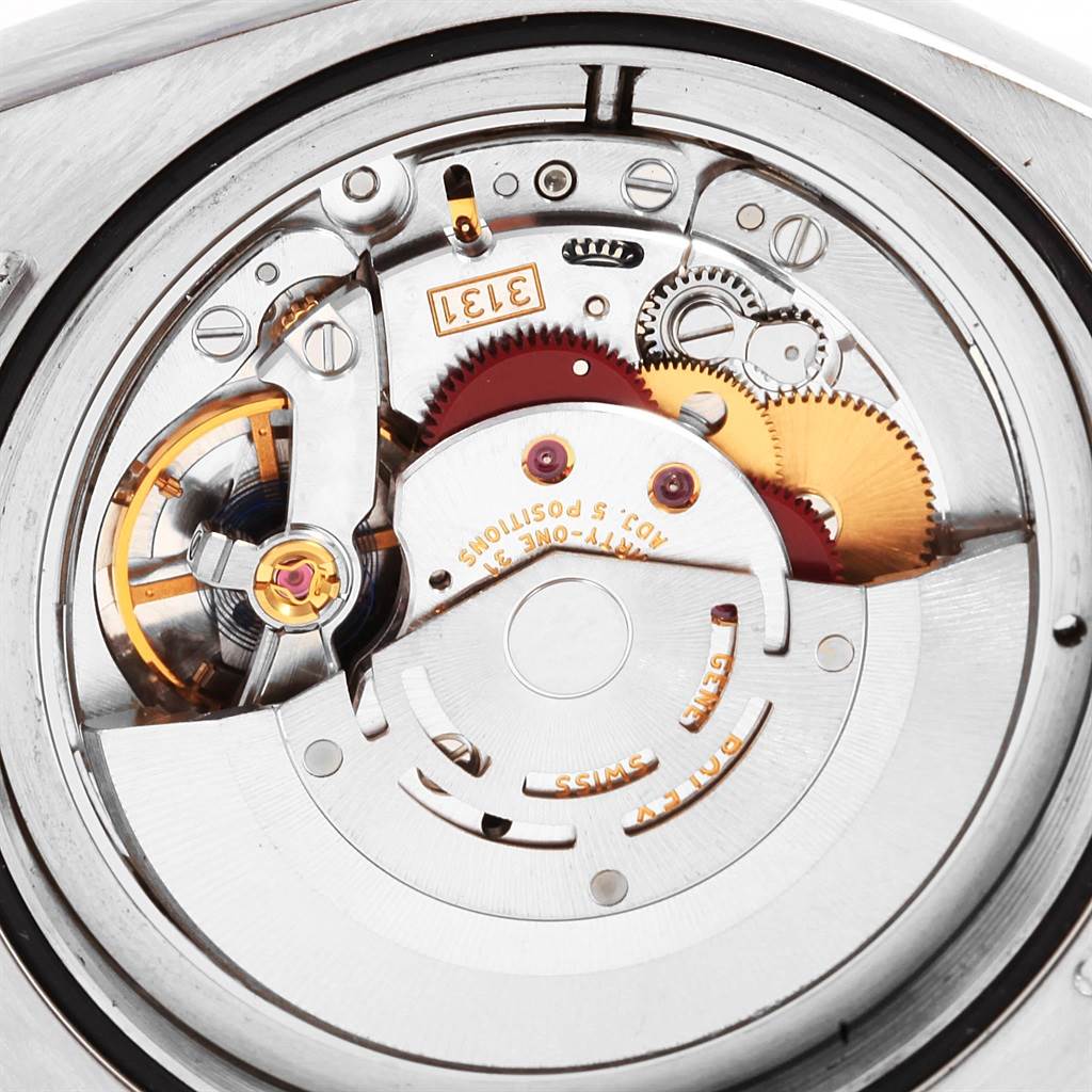 This image shows the intricate movement mechanism of the Rolex Milgauss 116400V Men's Stainless Steel Black Dial 116400V Men's Stainless Steel Black Dial watch from a close-up angle.