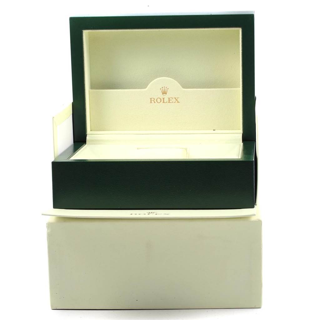 The image depicts an empty green and cream Rolex Milgauss 116400V Men's Stainless Steel Black Dial 116400V Men's Stainless Steel Black Dial watch box, viewed from the front with the lid open.