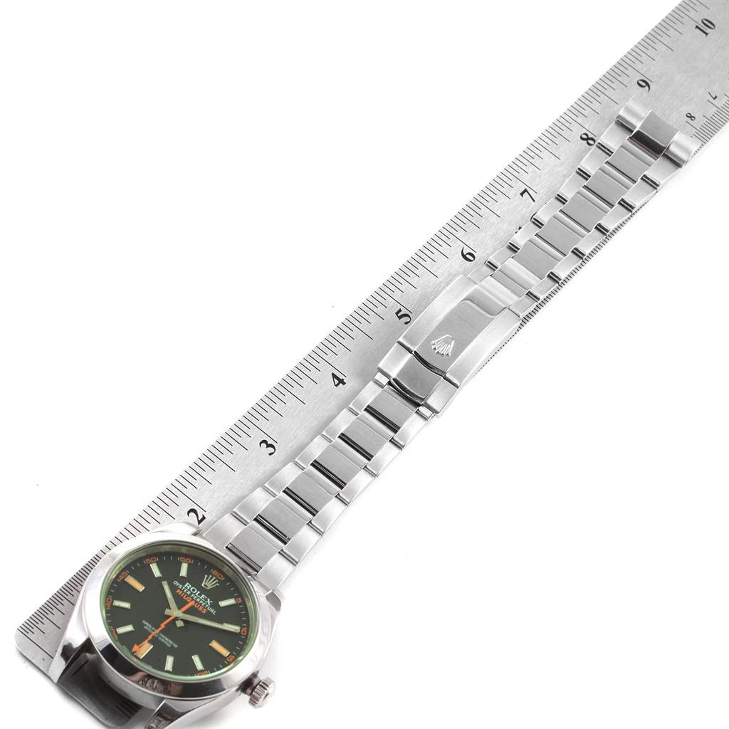This image shows a Rolex Milgauss 116400V Men's Stainless Steel Black Dial 116400V Men's Stainless Steel Black Dial watch laid next to a ruler, displaying the face, case, and bracelet.